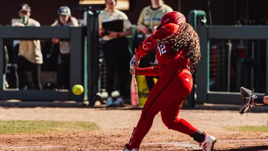 Jasmyn Burns hitting a double against Bryant in the Aggie Classic