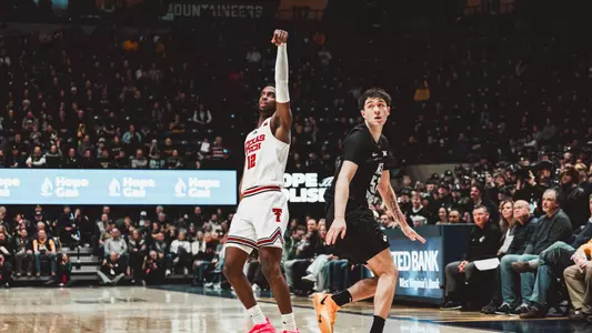 Donovan Atwell holds his shooting form and watches his second 3-pointer of the game go in against West Virginia.
