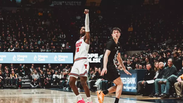 Donovan Atwell holds his shooting form and watches his second 3-pointer of the game go in against West Virginia.
