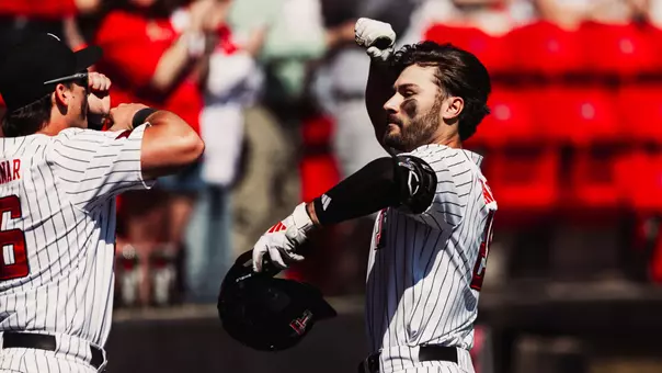 Robin Villeneuve celebrates one of his two home runs he hit in Sunday's contest vs. CSU Bakersfield