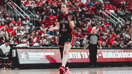 Adlee Blacklock clapping after making a three.