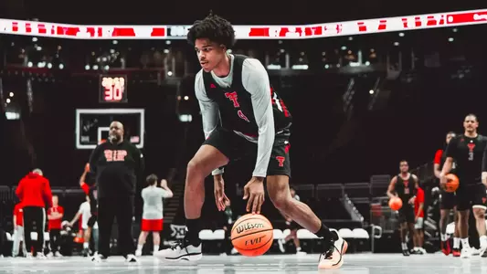 Christian Anderson goes through warmups before a practice at the Big 12 Tournament.