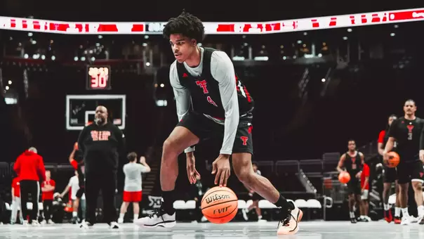 Christian Anderson goes through warmups before a practice at the Big 12 Tournament.