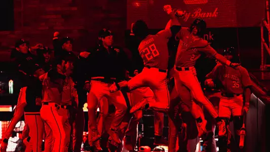 Texas Tech First Baseman Robin Villeneuve Celebrates in the dark, following his sixth inning go-ahead HR that helped the Red Raiders down No. 24 UTSA, 10-5 on Wednesday night
