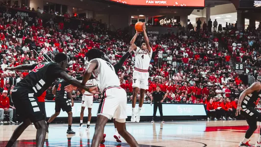 Christian Anderson puts up a 3-point shot against Cincinnati.