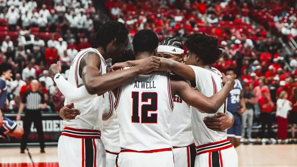 Donovan Atwell and the Red Raiders huddle together during a break in action against TCU.