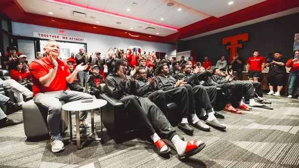 Grant McCasland and the Red Raiders celebrate after hearing their name called for the NCAA Tournament.