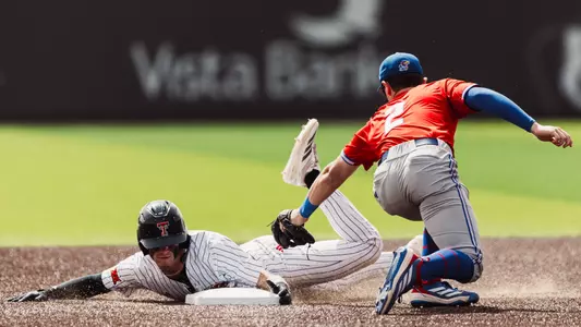 Junior Kyeler Thompson slides into second base during Sunday's series finale against Kanas