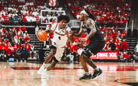 Christian Anderson drives to the basket against a K-State defender.