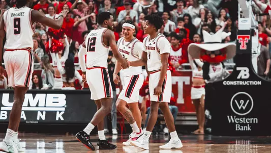 Donovan Atwell, LeJuan Watts and Christian Anderson celebrate a great play together in a win over Cincinnati.