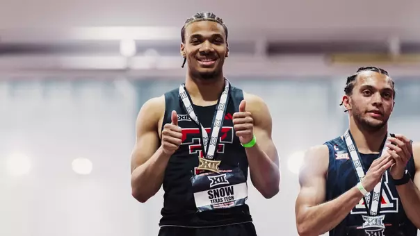 Malachi Snow at the medal stand during the Big 12 Indoor Championships