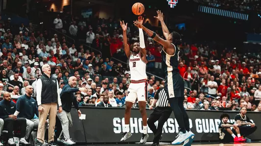 Donovan Atwell shoots a 3-pointer against Akron in the NCAA Tournament First Round.