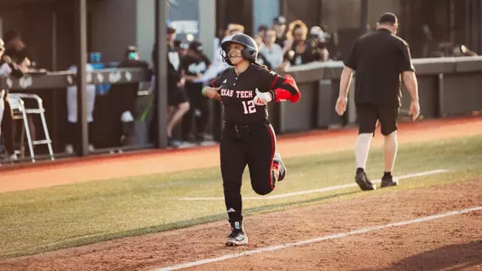 Jazzy burns heading to homeplate after hitting a home run against UCF