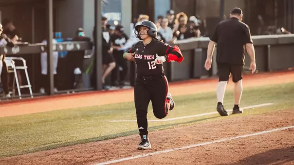 Jazzy burns heading to homeplate after hitting a home run against UCF