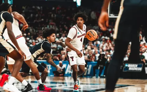 Christian Anderson looks for room to work against the Akron defense in the NCAA Tournament.