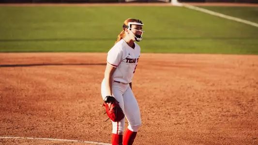 Kaitlyn Terry clebrating a strike out against UCF