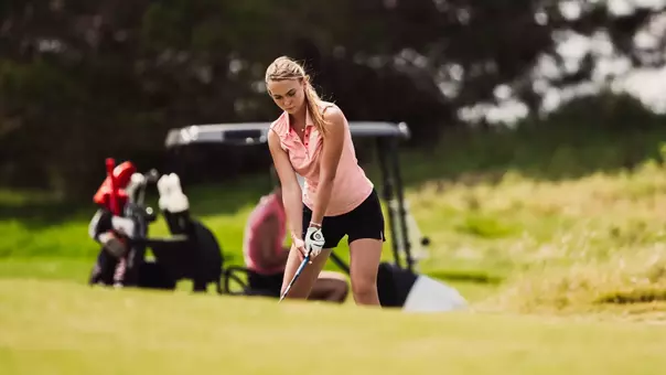 Denisa Vodickova prepares to strike an iron shot to the green