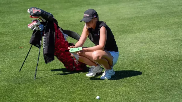 Denisa Vodickova plans out her second shot on the par 4 ninth hole
