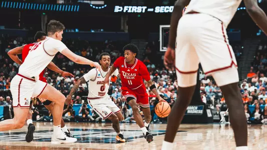 Jaylen Petty tries to find space in the Alabama defense during the NCAA Tournament Second Round.