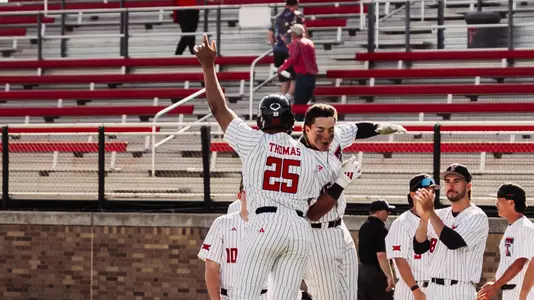 The Red Raiders celebrate their run-rule walk-off win Tuesday afternoon vs. New Mexico