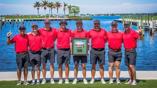 Team photo of the men's golf team after winning the Valspar Collegiate Invitational