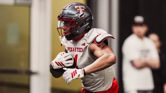Kenny Johnson tucks the ball away during a Texas Tech spring practice.