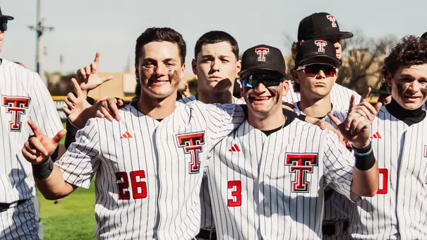 Infielders Matt Quintanar and Tracer Lopez pose after the Red Raiders 12-2 win over UNM Tuesday