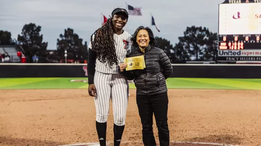 NiJaree Canady with AUSL commissoner Kim Ng after recieving the Golden Ticker