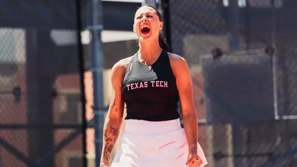 Yekaterina Dmitrichenko celebrating a match win.