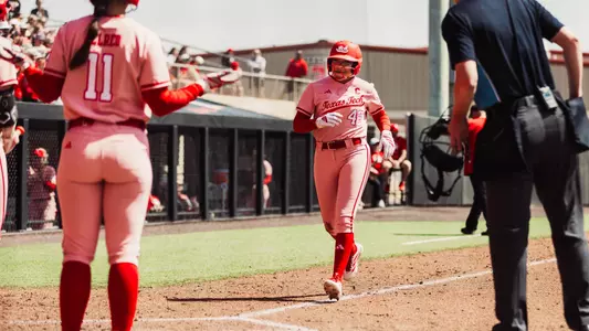 Mihyia davis reaches home plate after hitting a home run against Iowa State