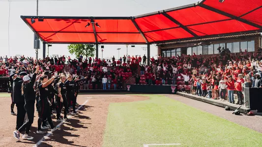 Texas Tech softball and fans singing the matador song at Tracy Sellers Field following a game