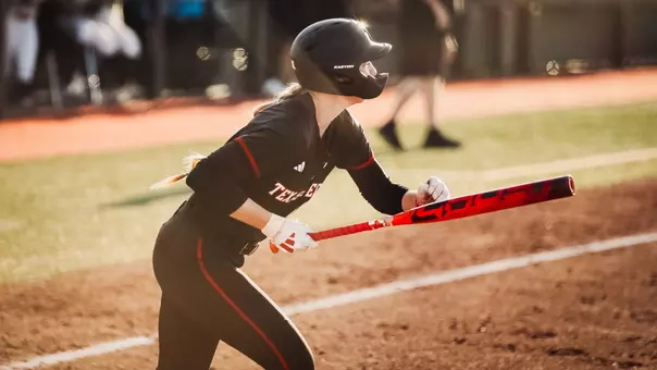 Hailey Toney leaving the batters box after recording a hit in a softball game