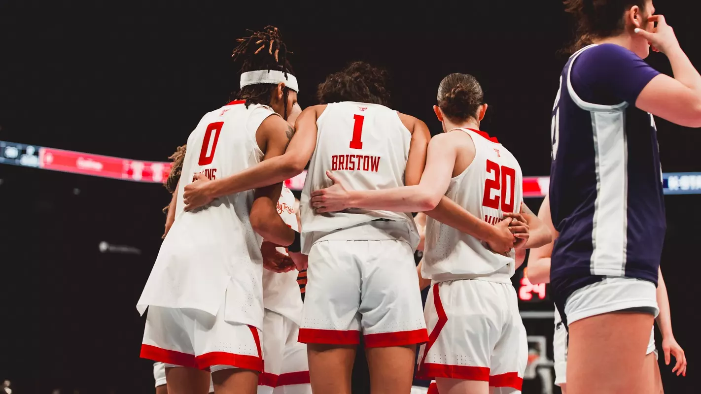 The Lady Raiders huddle up during the game.