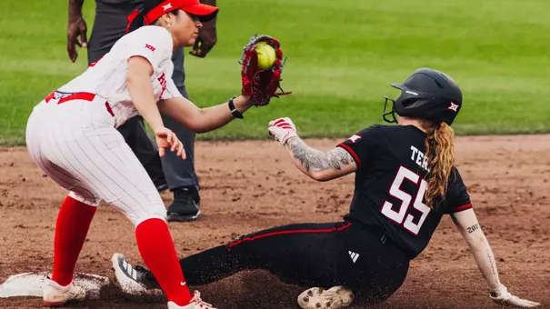 Kaitlyn terry sliding into second base as she steals a bag against Houston