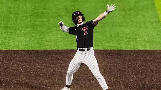 Texas Tech OF Kyeler Thompson celebrates following on his four hits and two doubles during Texas Tech's Friday night 15-7 win over Penn State
