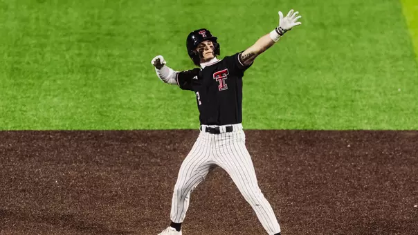 Texas Tech OF Kyeler Thompson celebrates following on his four hits and two doubles during Texas Tech's Friday night 15-7 win over Penn State