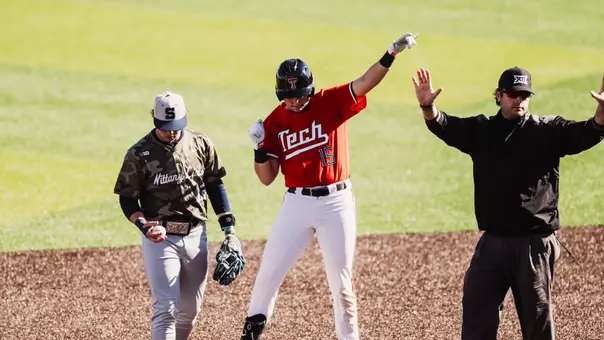 Caden Ferraro celebrates a two-base hit during the Red Raiders Run-Rule win against Penn State (Mar. 7)