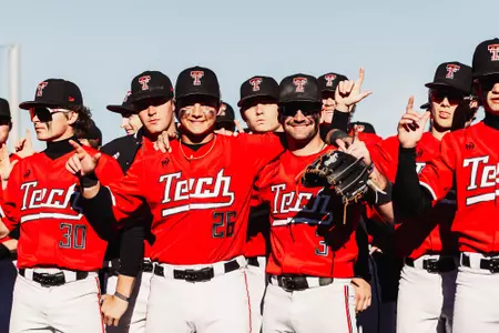 Catcher Matt Quintanar and INF Tracer Lopez pose following the Red Raiders win over Penn State on Saturday, Mar. 7