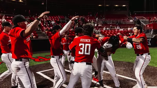 The Red Raiders celebrate Caden Ferraro's Walk-off home run Tuesday night in Tech's 15-4 run-rule win over ACU