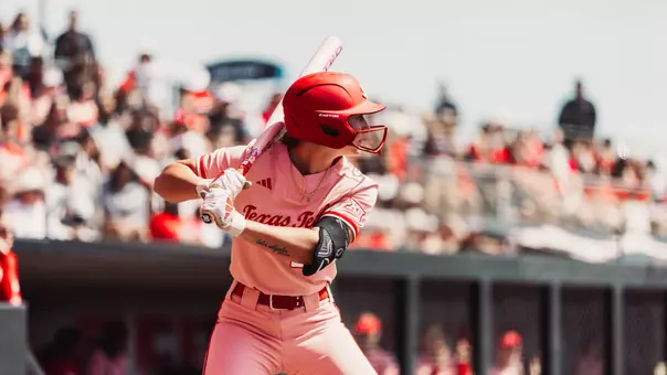 Jackie Lis stands ready in the batter's box as a pitch is about to be delivered.