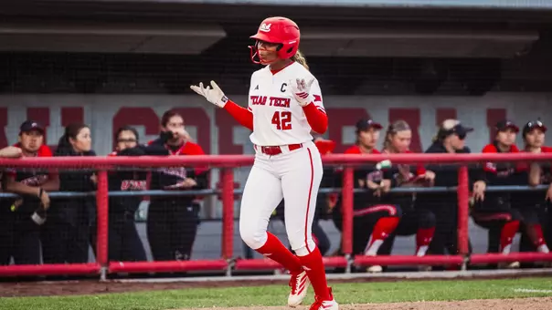 Mihyia Davis shrugs her shoulders as she approaches home plate after hitting a home run