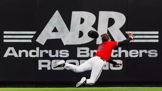 Texas Tech OF Logan Hughes makes a diving catch as hit ball cap flies off his head during Saturday afternoon's 4-1 win over No. 17 WVU