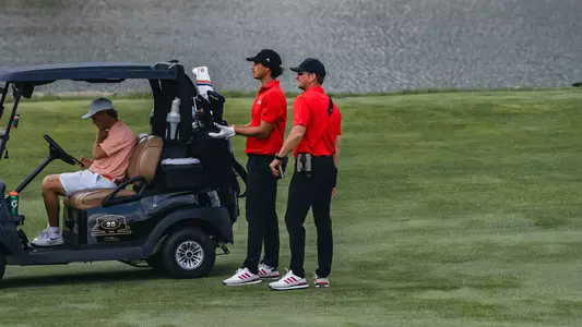 Adam Bresnu and Greg Sands deliberate the next shot during the Mountaineer Invitational