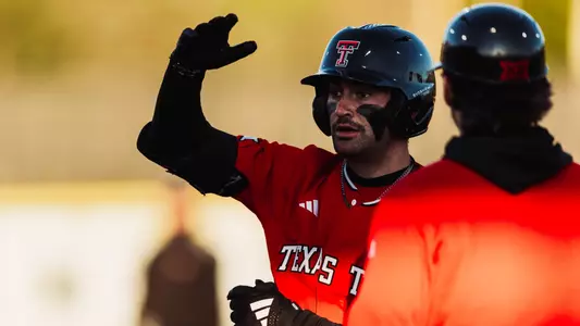 Senior Tracer Lopez Celebrates one of his three hits in Friday's game at Utah