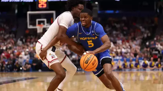Cruz Davis drives into the lane against an Alabama defender during the NCAA Tournament.