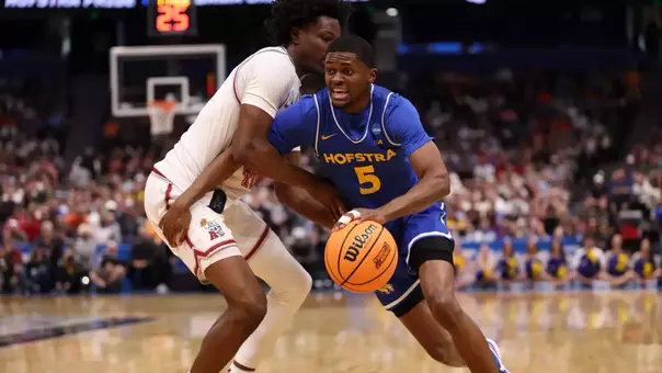 Cruz Davis drives into the lane against an Alabama defender during the NCAA Tournament.
