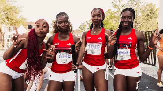 Left to right: Mekenze Kelley, Lovina Ewusi, Collinique Farrington and Vanessa Balde pose for a photo after breaking the school record in the 4x400 at the Tom Jones Memorial Invitational