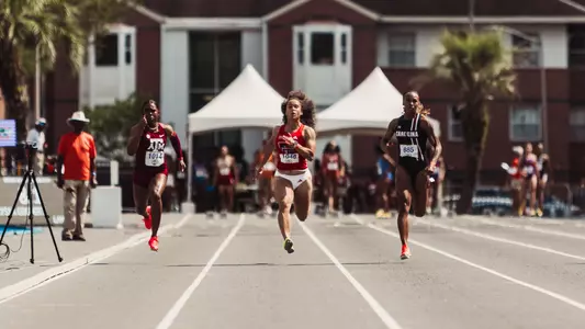 Alyssa Colbert running in the 100 meter dash at the Tom Jones Memorial meet