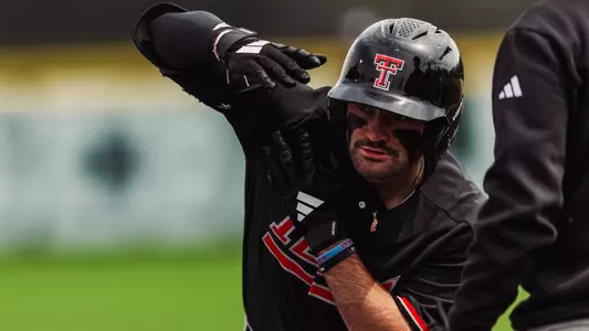 Tracer Lopez celebrates his first inning single that tied him with Scott LeJeune