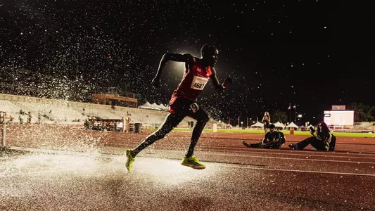 Titus Kimaru leaping for the steeple barrier at the Texas Relays